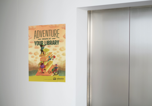Wall mock up of a large poster next to elevator doors.