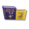 Front and back views of an assemble-it-yourself paper book bank designed to resemble a purple and yellow book. The front features Nibbleton Finch, a mouse holding a skeleton key, with the phrase “Saving for Books Is Key.” The yellow panel encourages saving money for books. The back features a coin slot above Inspector Whiskers, a black cat peeking out in a yellow detective hat.