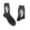 Pair of black crew socks featuring Will-O-the Whisperer, a friendly white ghost wearing glasses and holding a colorful stack of books. The phrase “I'm Booooooked” curves around the ghost in white lettering. One sock is shown unfolded and the other folded against a white background.
