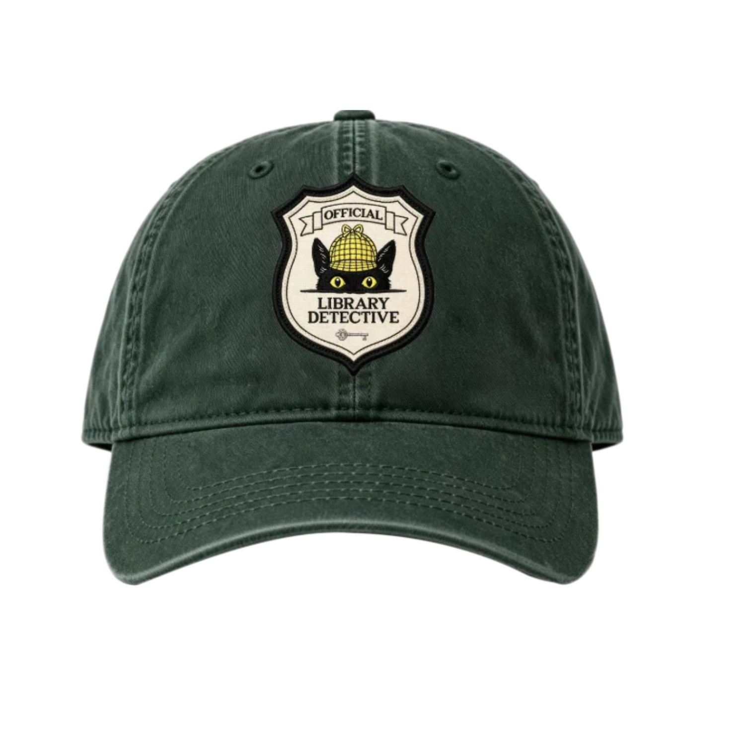 Dark forest green dad cap featuring a shield-shaped “Official Library Detective” patch with Inspector Whiskers, a black cat with yellow eyes wearing a detective hat.