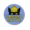 Product rendering of a 2-1/4" round “I’m Basically a Detective” button featuring Inspector Whiskers in a yellow detective cap.