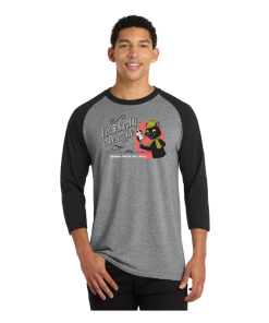 Model wearing a heather gray raglan shirt with black three-quarter-length sleeves and a black crew neckline. The front features the phrase “I'm Basically a Detective” alongside Inspector Whiskers, a black cat detective holding a magnifying glass, with the “Mysteries Await at Your Library” slogan beneath.
