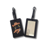 Black Inspector Whiskers luggage tag shown from the front and back. The front features a colorful raised design of the black cat detective wearing a brown hat and scarf and holding a magnifying glass. The reverse has a clear identification window with lines for name, address, and telephone number. Both sides feature an adjustable black attachment strap.