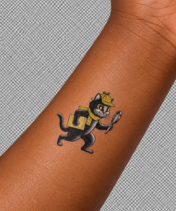 Close-up of a child’s forearm featuring a small temporary tattoo of Inspector Whiskers, a black cat detective wearing a yellow hat and scarf and carrying a book and magnifying glass.